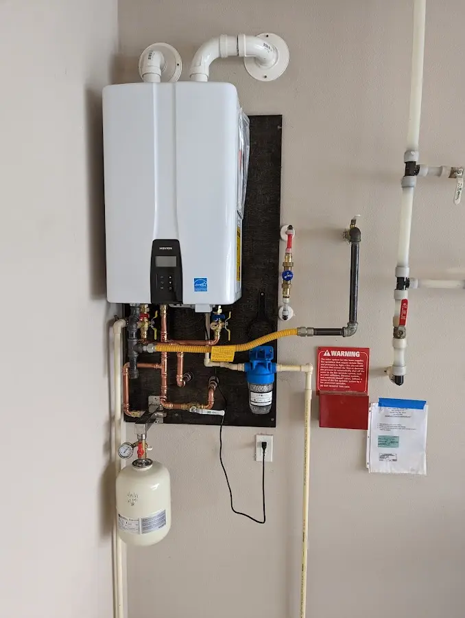 Professional plumber installing copper piping in a Lufkin home